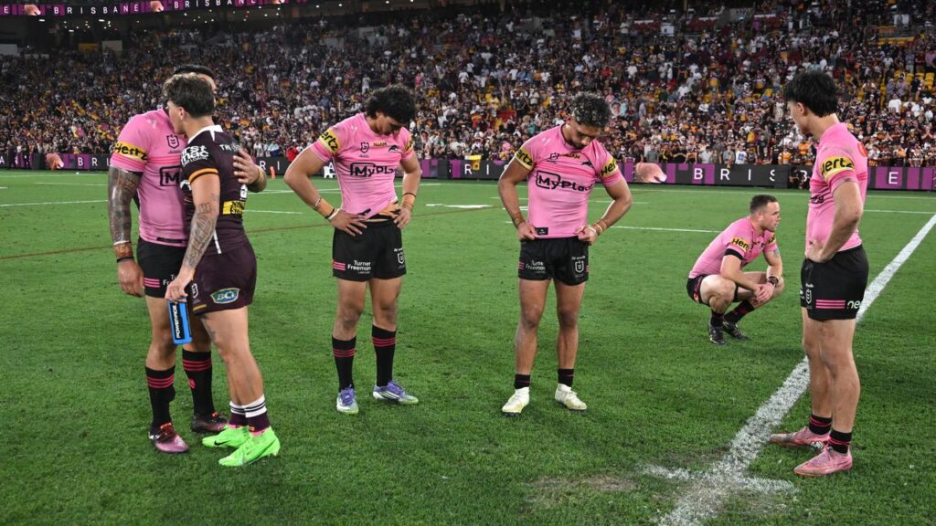 Brisbane star Reece Walsh consoles the Panthers after ending their bid for a fifth straight title.
