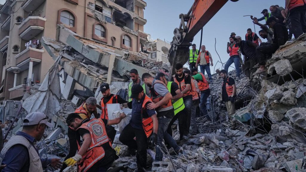 A dozen people, including at least five children, were killed when a building collapsed in Gaza.
