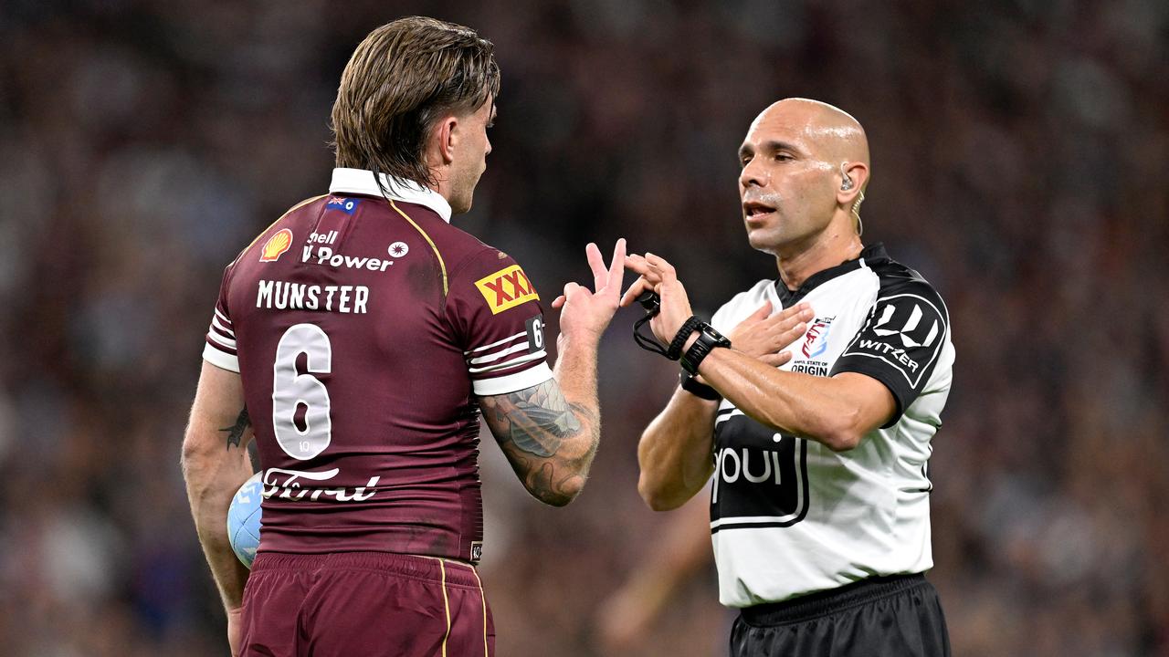 Queensland's Cameron Munster remonstrates with Ashley Klein