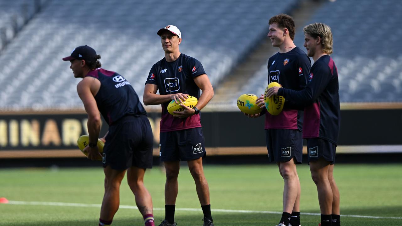 Lions players get a feel for the MCG at a training session on Friday.