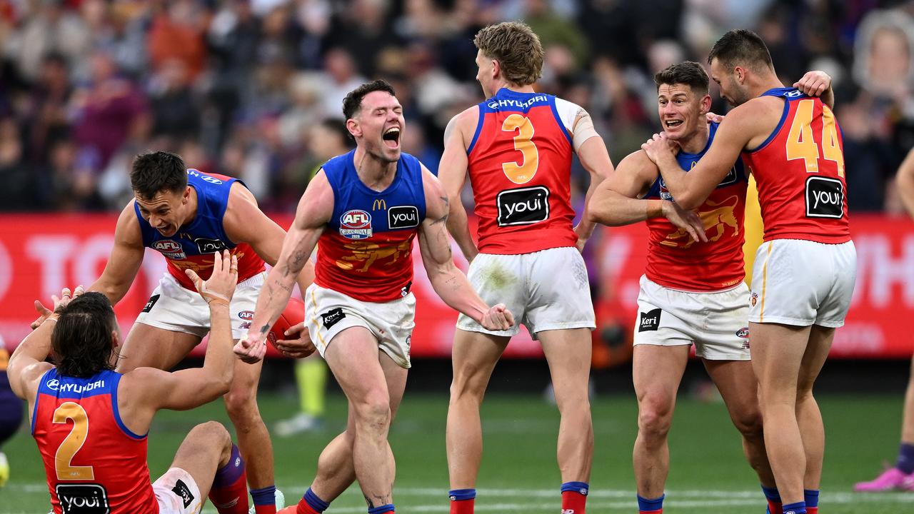 Lachie Neale of the Lions (centre)