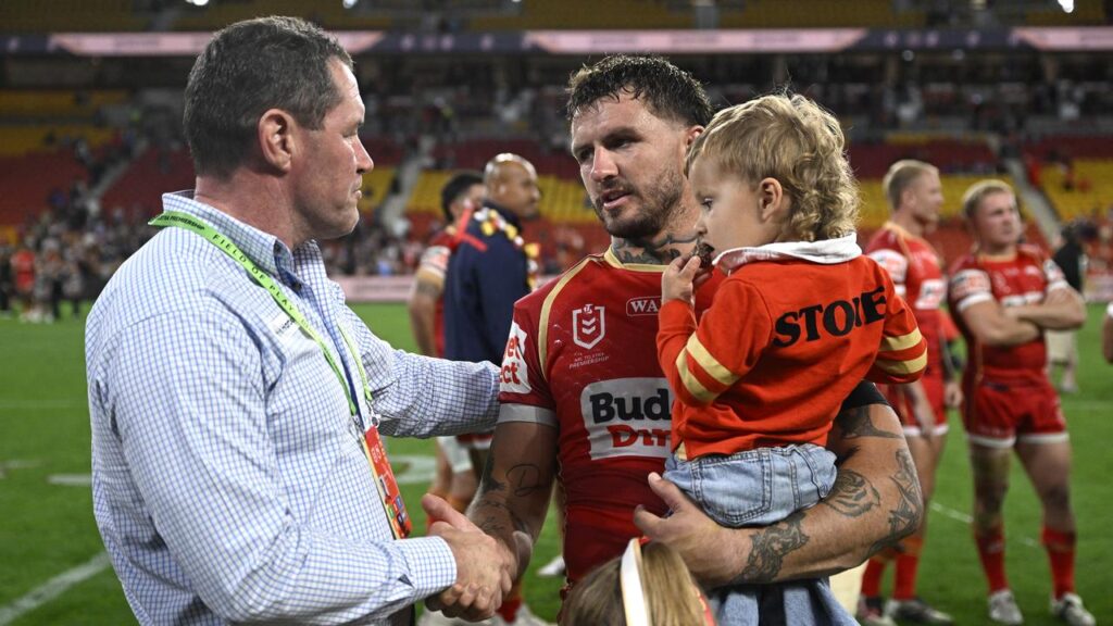 Coach Kristian Woolf with retiring forward Ray Stone after the Dolphins’ preliminary final loss.
