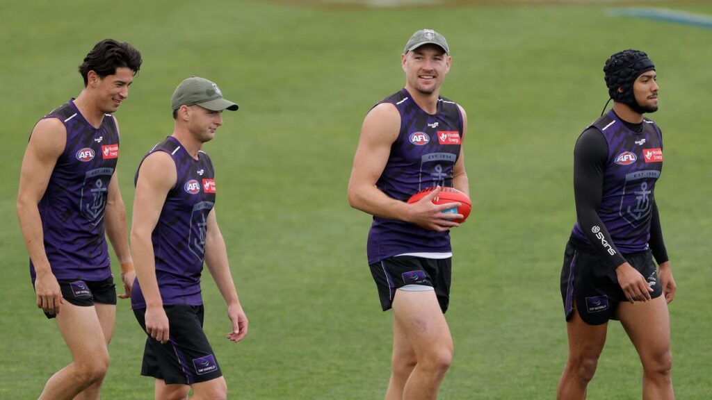 Brennan Cox (centre) looked upbeat as the Dockers trained in front of their Fremantle fans.
