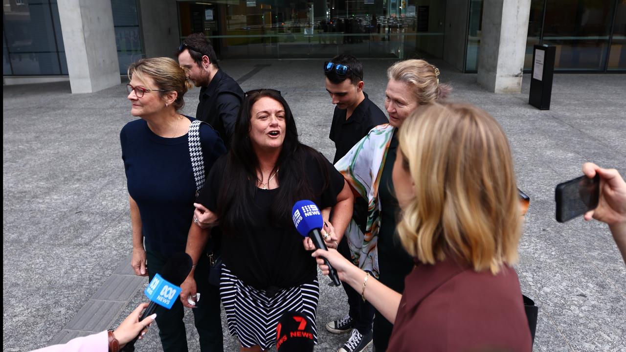 woman talks to media