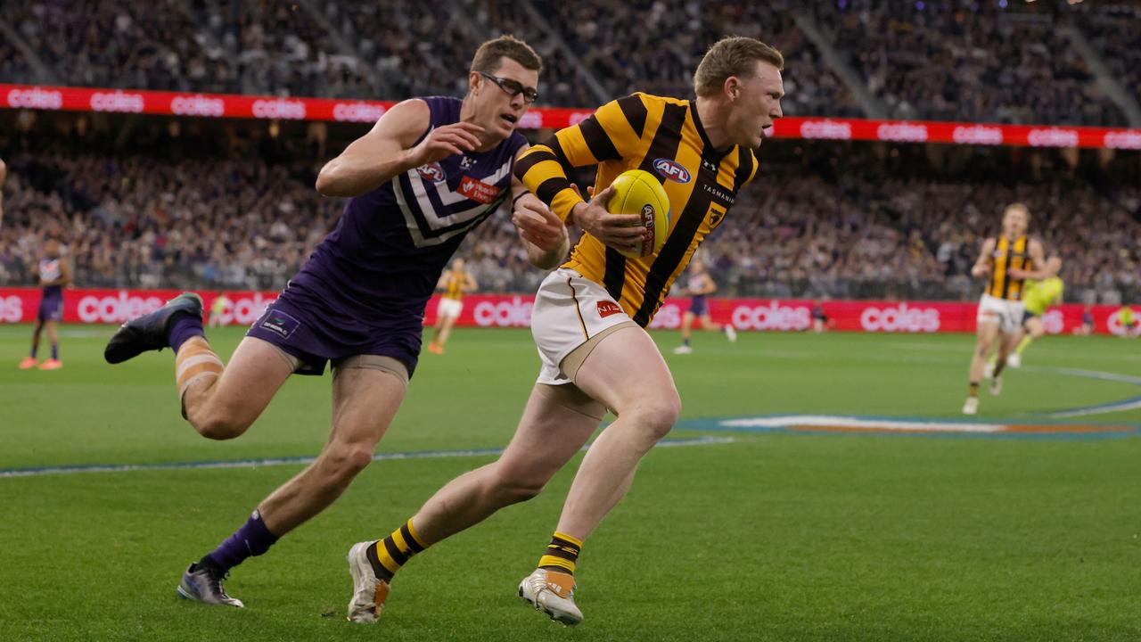 Mason Cox chases James Sicily.