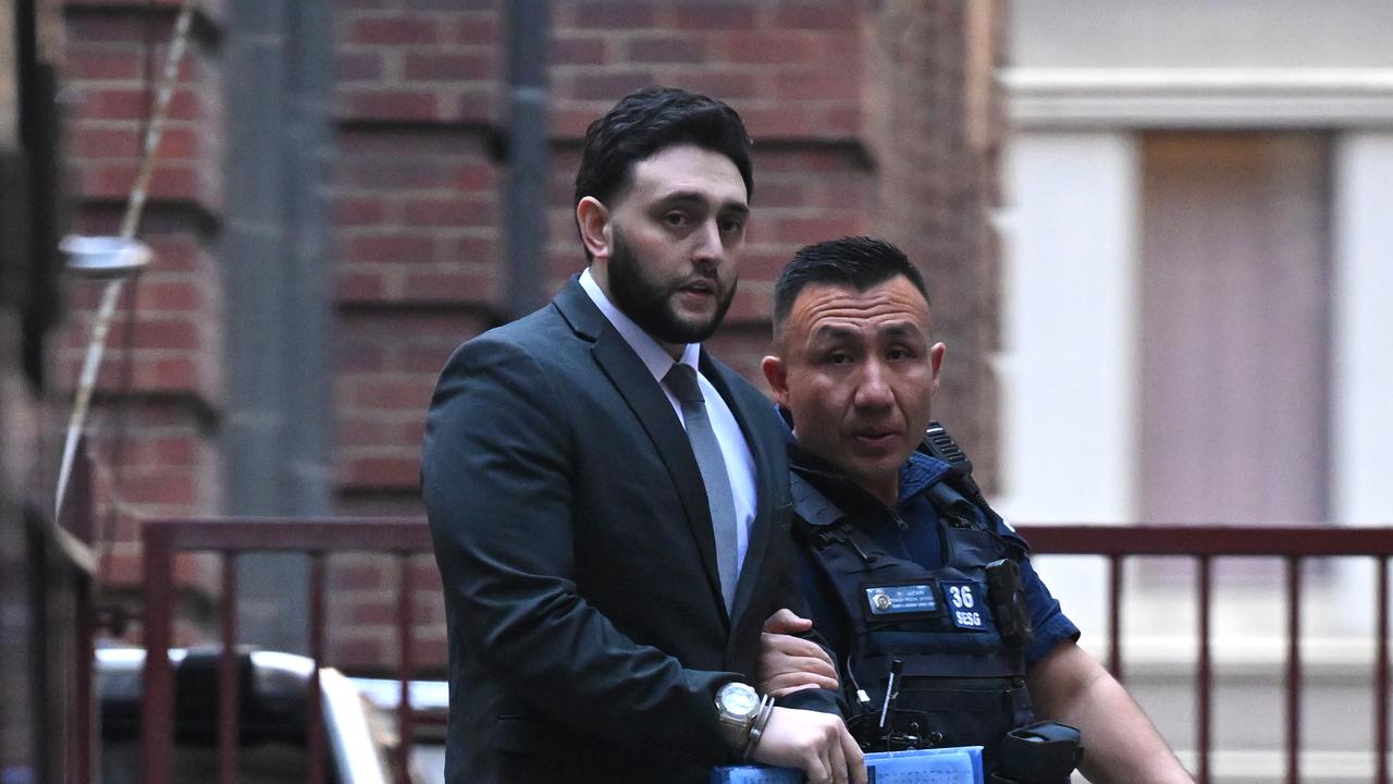 Rabil Zahabe in handcuffs