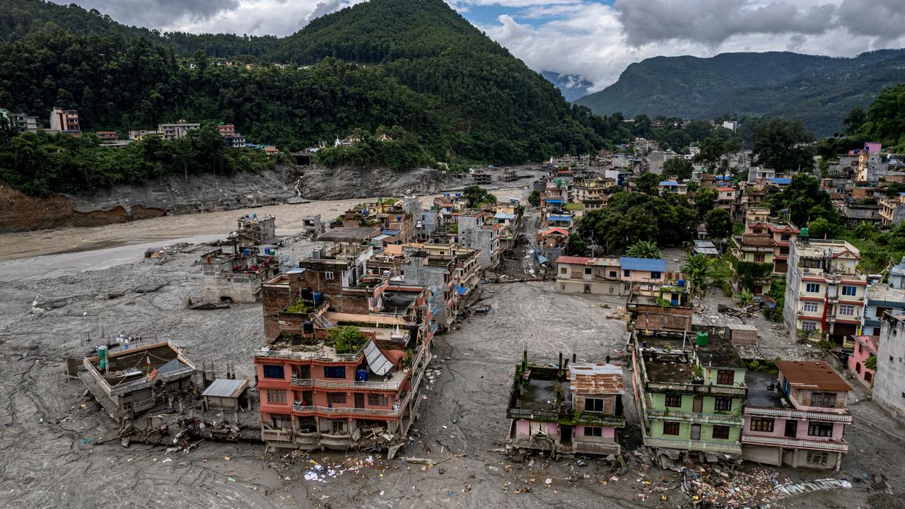 Damaged residential buildings along the Trishuli River