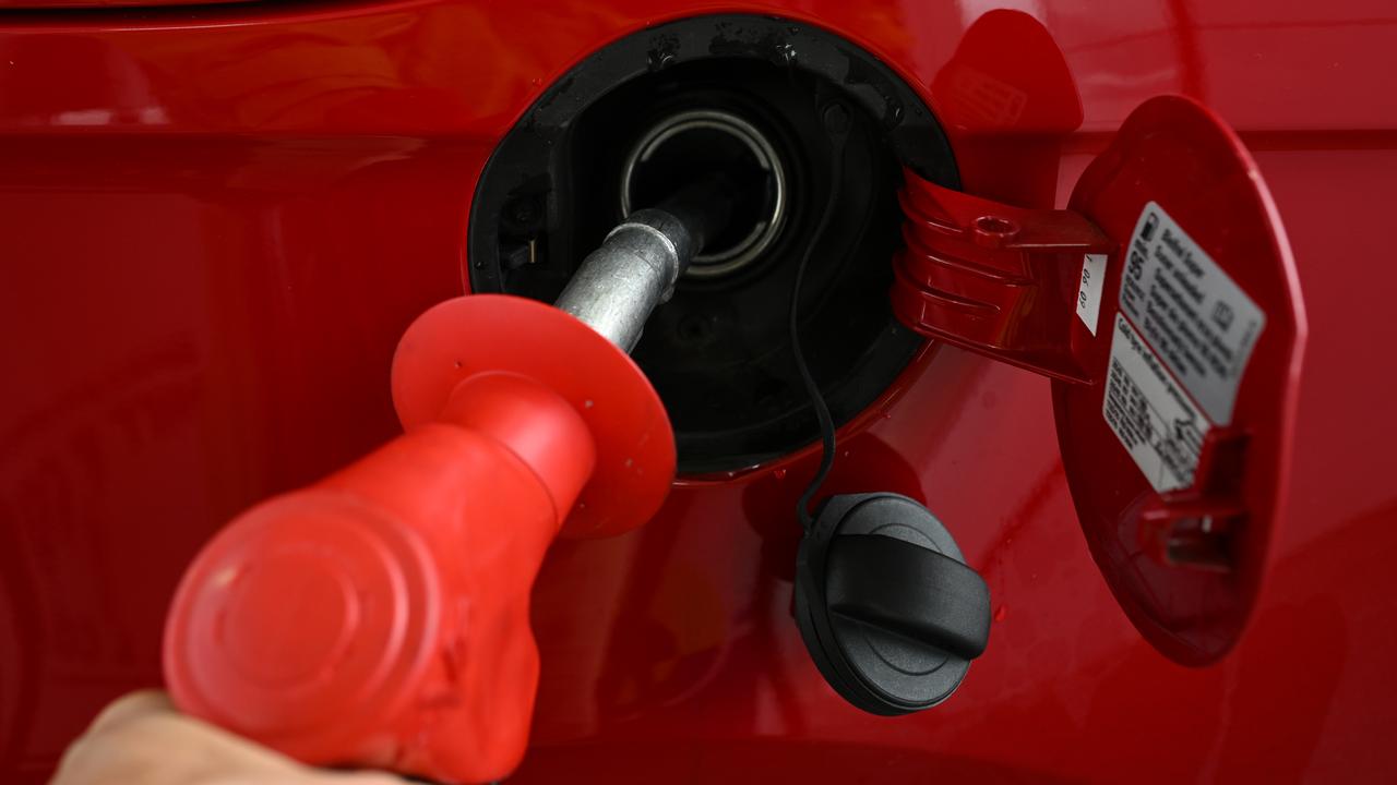 A fuel pump nozzle is used at a petrol station (file image)