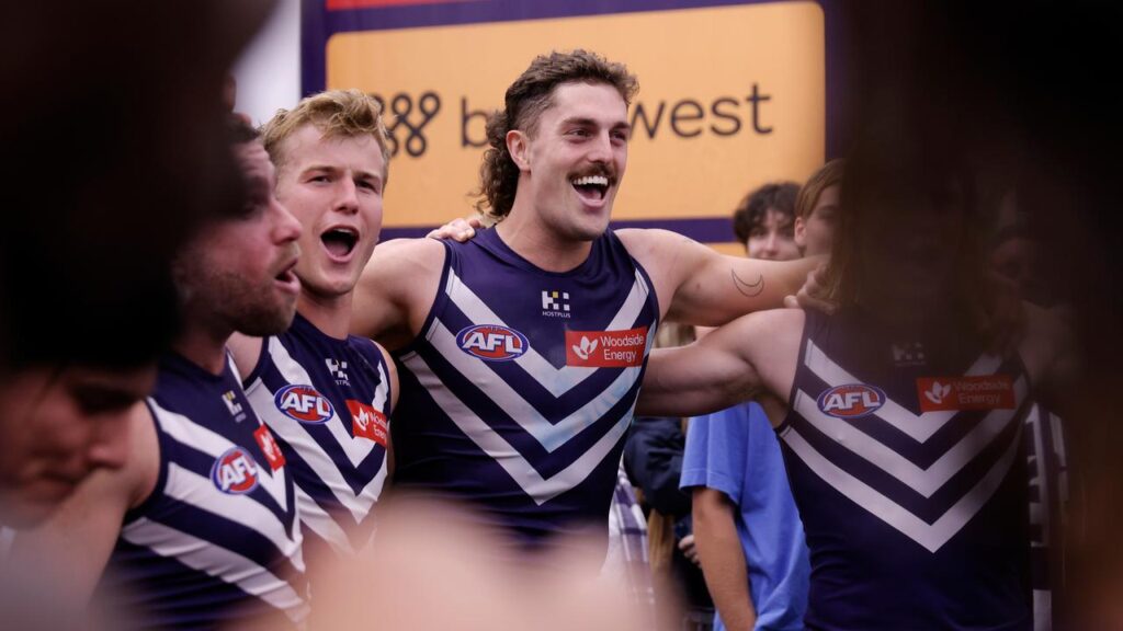 Luke Jackson leads the Dockers’ club song chorus after Fremantle’s big night in Perth.
