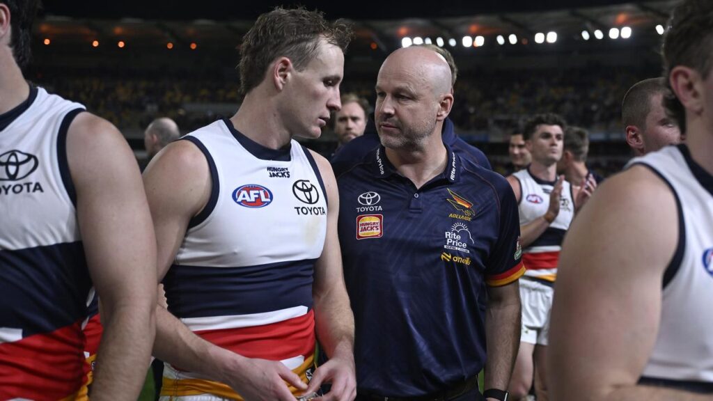 Crows boss Matthew Nicks and captain Jordan Dawson exit the Gabba after their loss to Brisbane.
