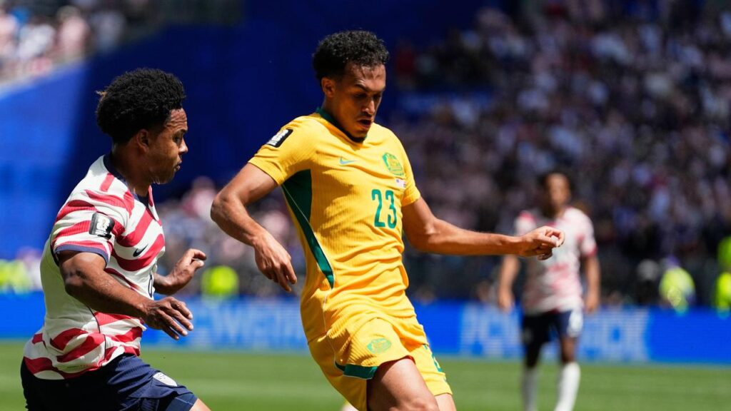 Nishan Velupillay in action for the Socceroos against the USA at the World Cup.
