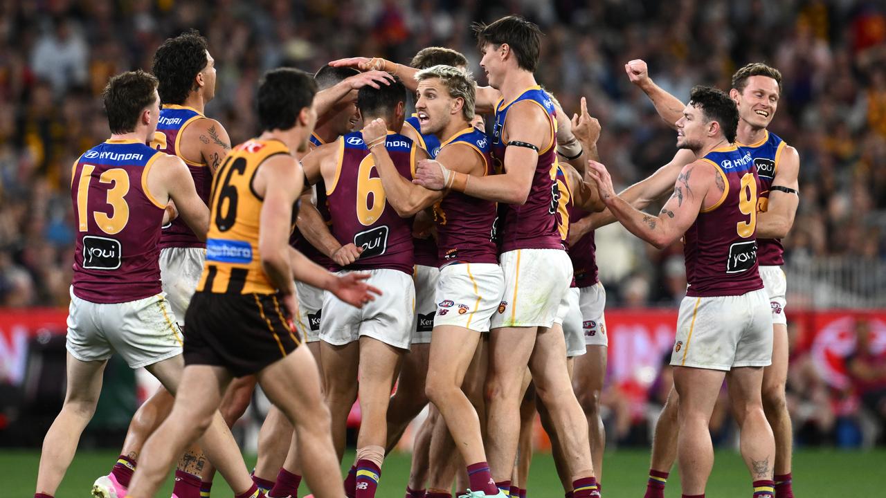 Brisbane players rush to Hugh McCluggage (No.6)