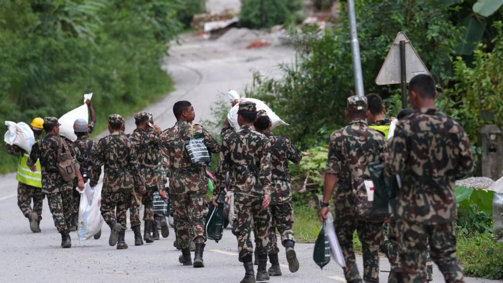 Rescuers in Nepal are contending with collapsed tunnels and floodwaters that make access difficult.
