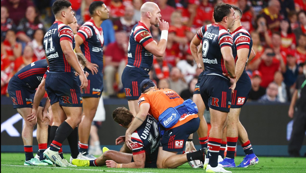 Connor Watson of the Roosters receives treatment
