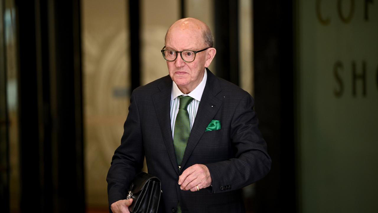 man in suit leaves court