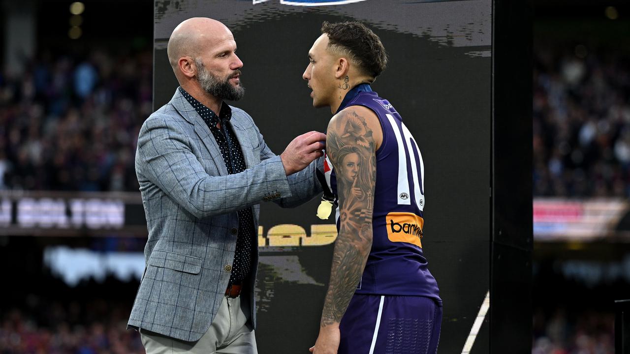 Paul Chapman presented Shai Bolton with the Norm Smith Medal.