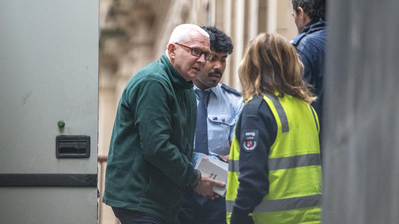 Timothy Loosemore exiting truck with Bible in hand