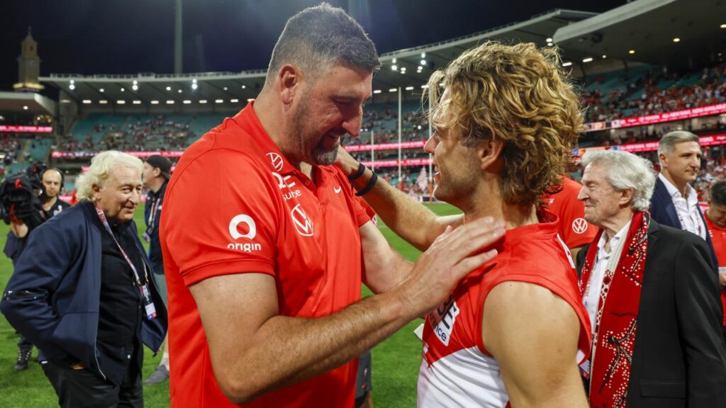 Dean Cox and midfield gun James Rowbottom celebrate the Swans’ win, but know the job’s not done yet.
