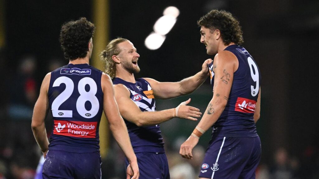 Hayden Young (centre) and Luke Jackson were pivotal in the Dockers’ victory.

