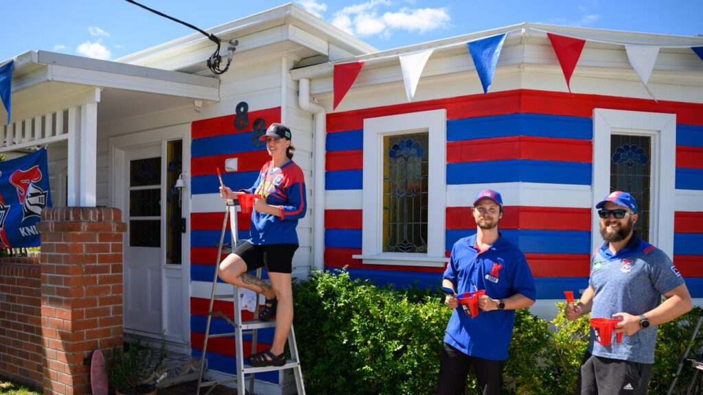 Teigan Jobbins (left) with brother Billy and husband Sam (right) are showing their true colours.
