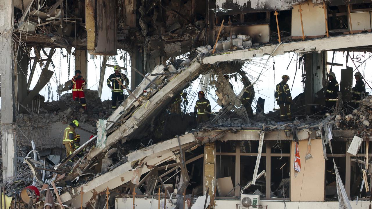 Ukraine rescue workers in rubble