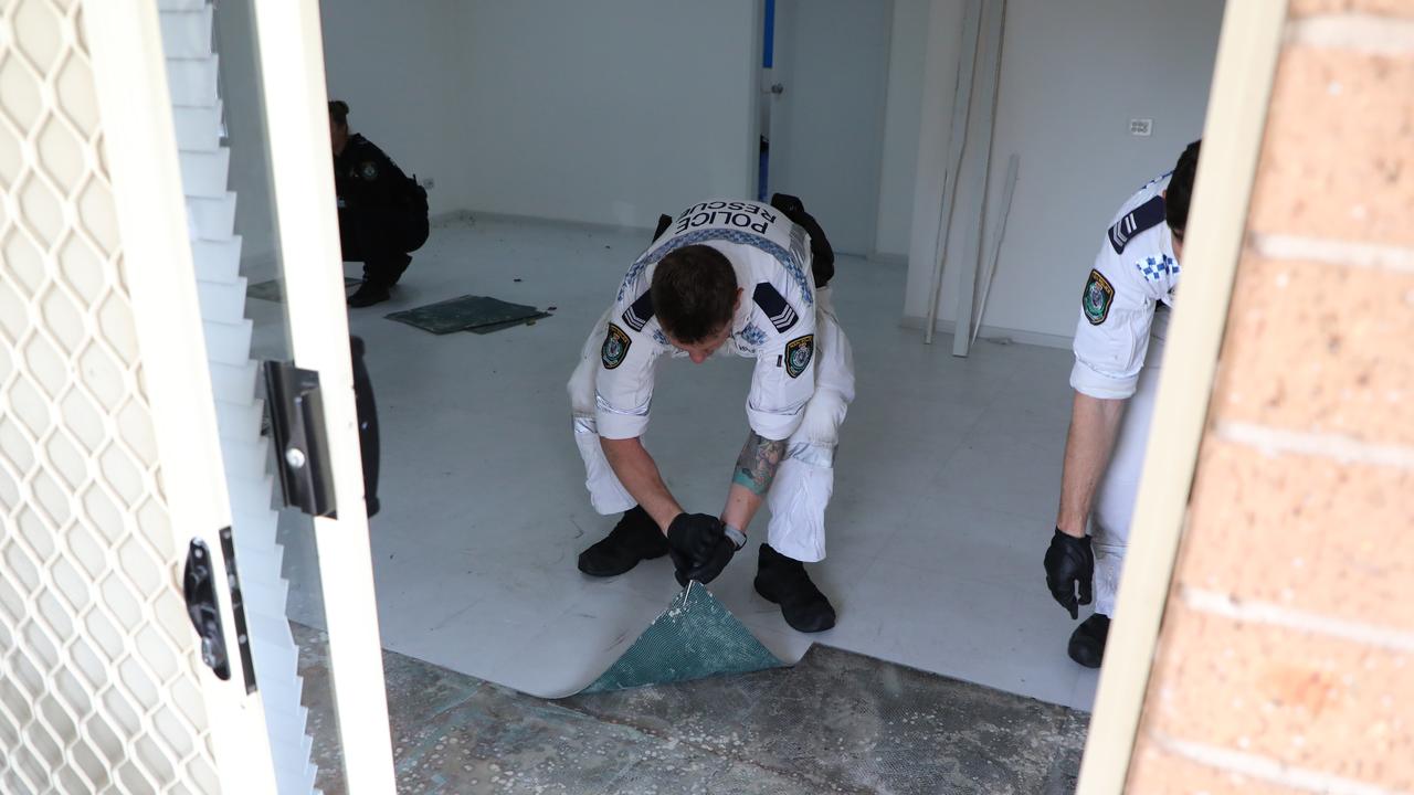 Forensic police lifting lino