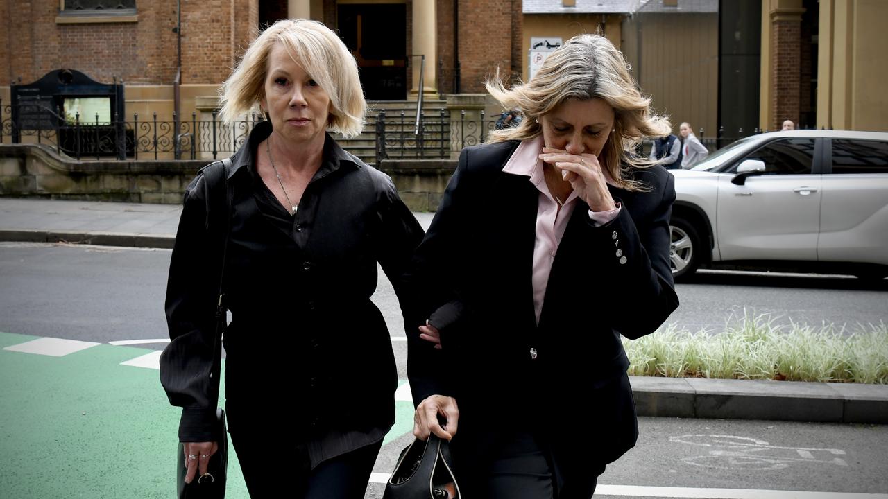 two women arm in arm
