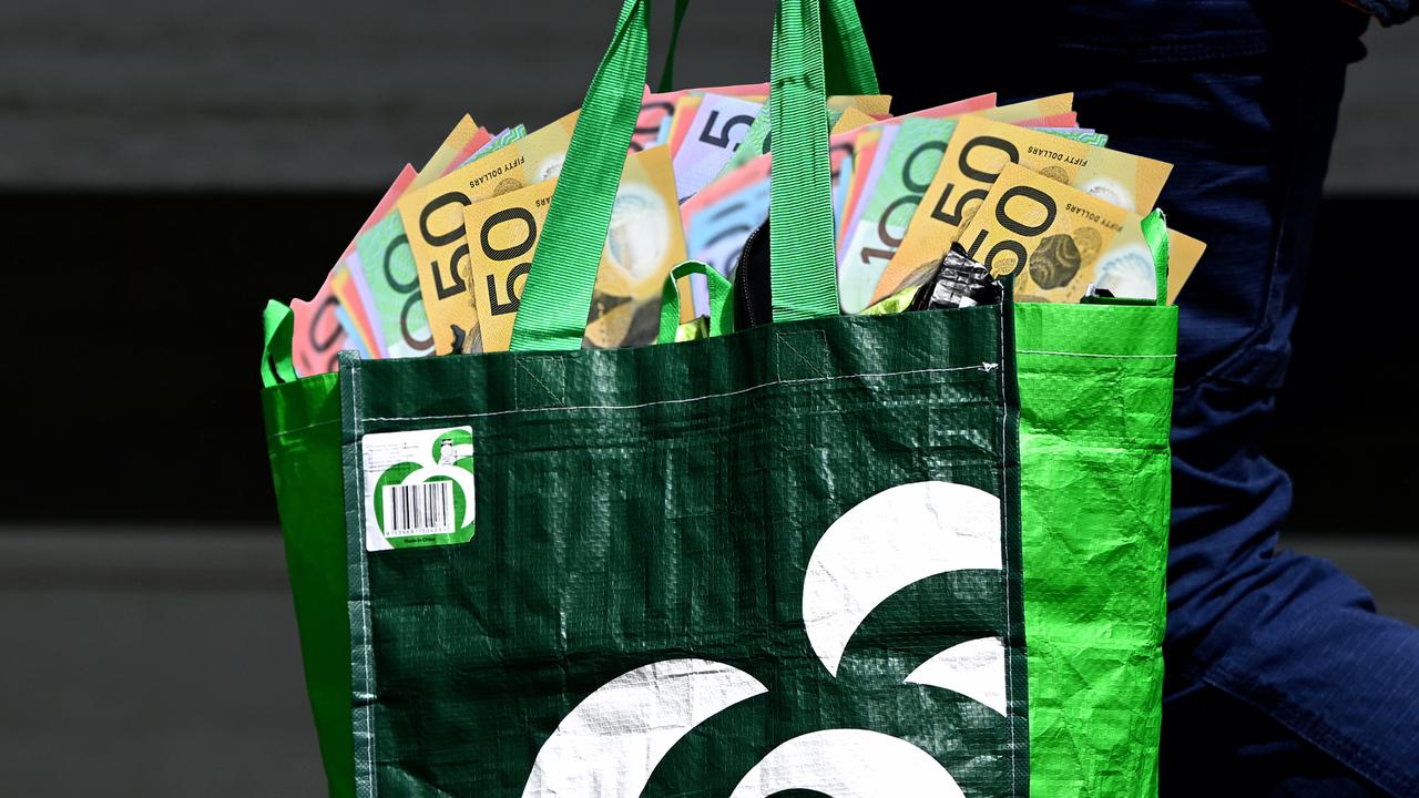 A Woolworths shopping bag full of cash