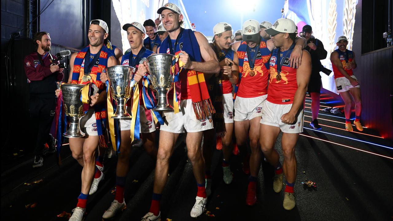 (L-R) Josh Dunkley of the Lions,