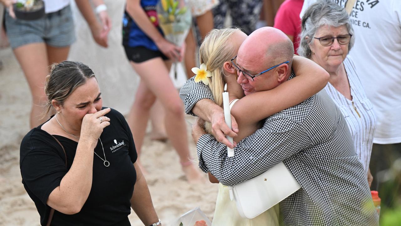 people hugging and crying