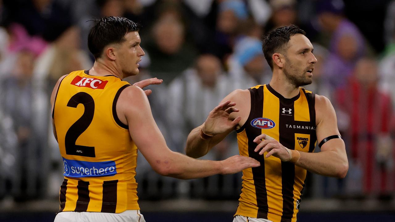 Jack Gunston of the Hawks is congratulated by Mitchell Lewis