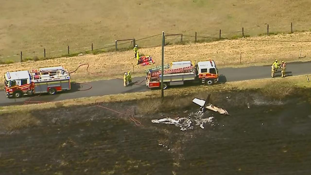 Emergency services work at the scene of a light aircraft crash