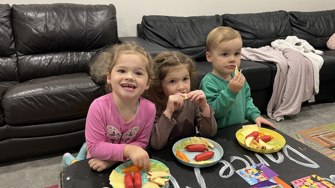 Pippa and siblings eating frankfurts, cheese and fruit