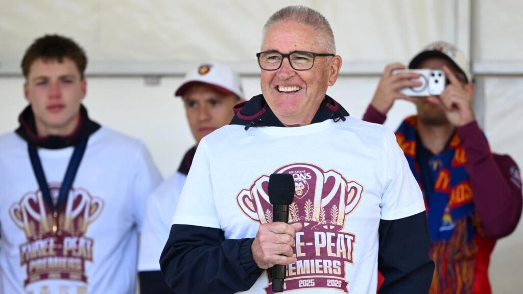 Brisbane Lions coach Chris Fagan speaks to the crowd after his side’s epic AFL grand final win.
