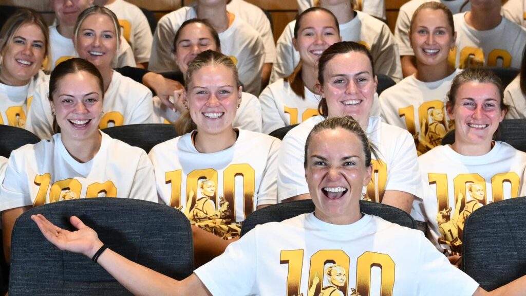 Emily Bates and her teammates wear the commemorative T-shirts that are everywhere at Hawthorn.
