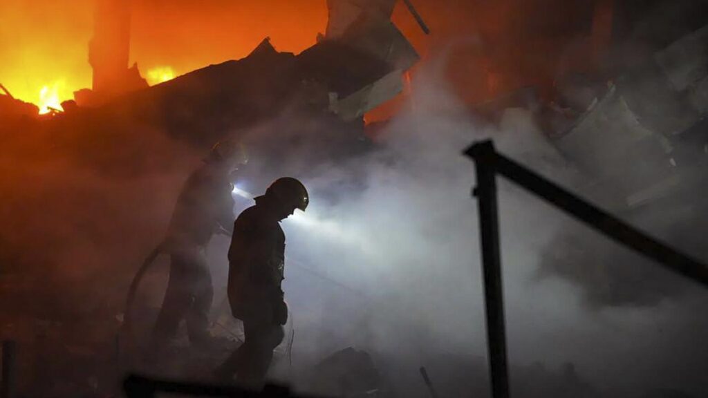 Kyiv authorities say homes, warehouses and dozens of cars have been damaged in a Russian attack.
