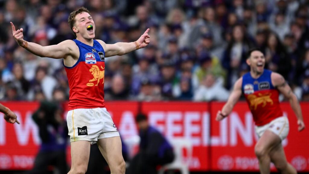 Brisbane’s grand final matchwinner Logan Morris (l) played for weeks with a back stress fracture. 
