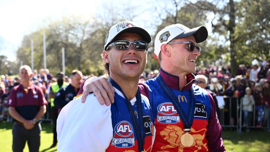 Cam Rayner (left) and Ryan Lester enjoy the spoils of victory at the Brunswick Oval fan event.
