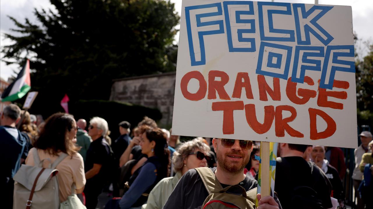 A protester with a sign that says 