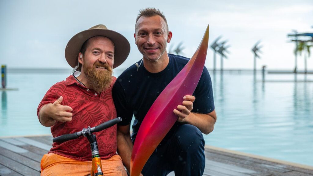 Paralympian Grant “Scooter” Patterson and Ian Thorpe revealed the first piece of the Olympic emblem.
