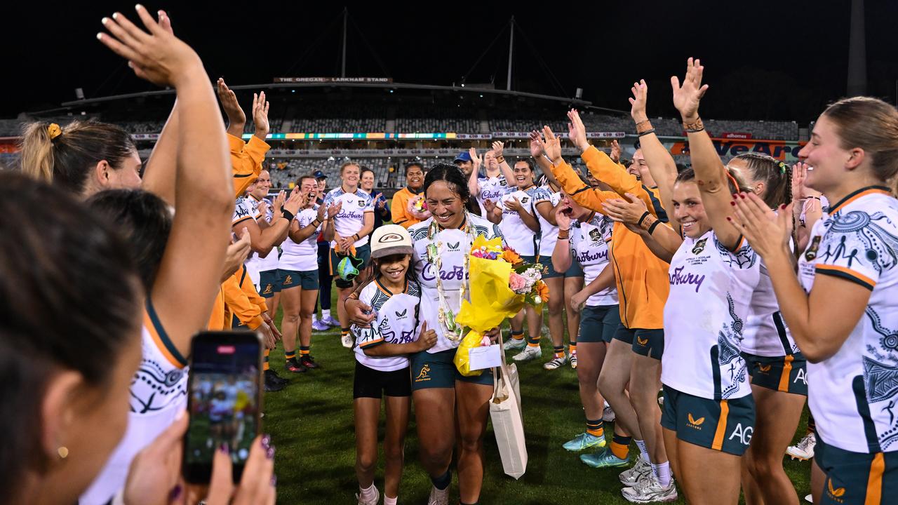 Cecilia Smith of the Wallaroos cheered off