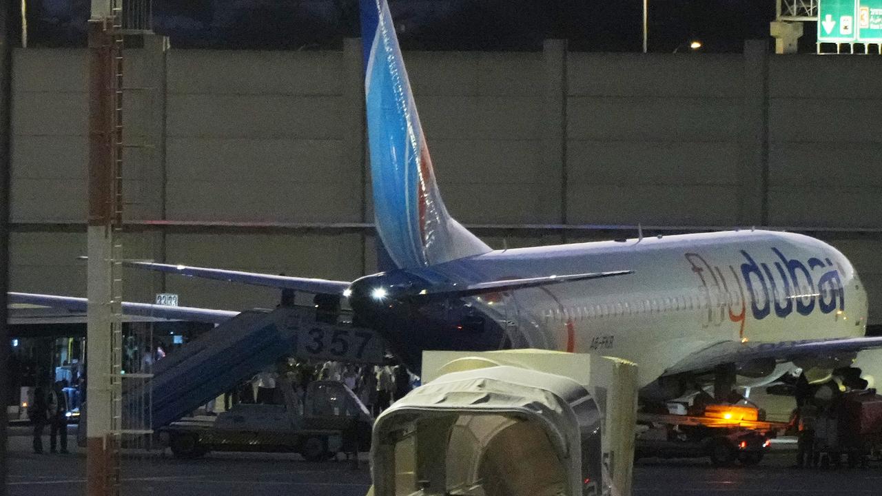 People disembark from a FlyDubai plane at Ben Gurion airport