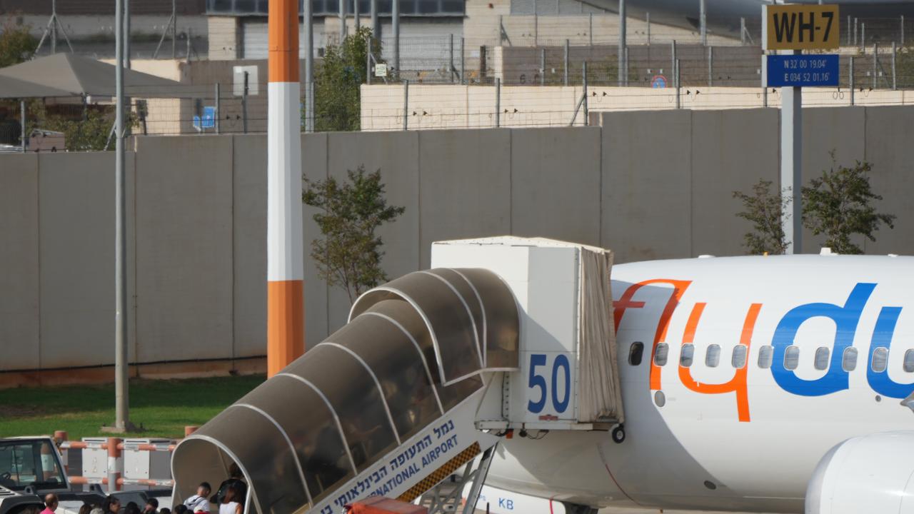 Passengers embark on a flyDubai aircraft