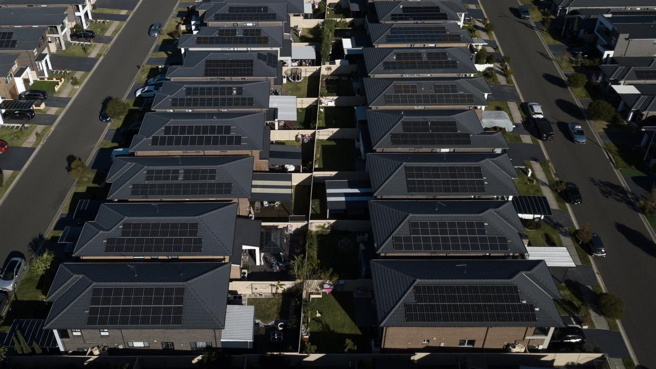 Houses are seen with rooftop solar panels (file image)