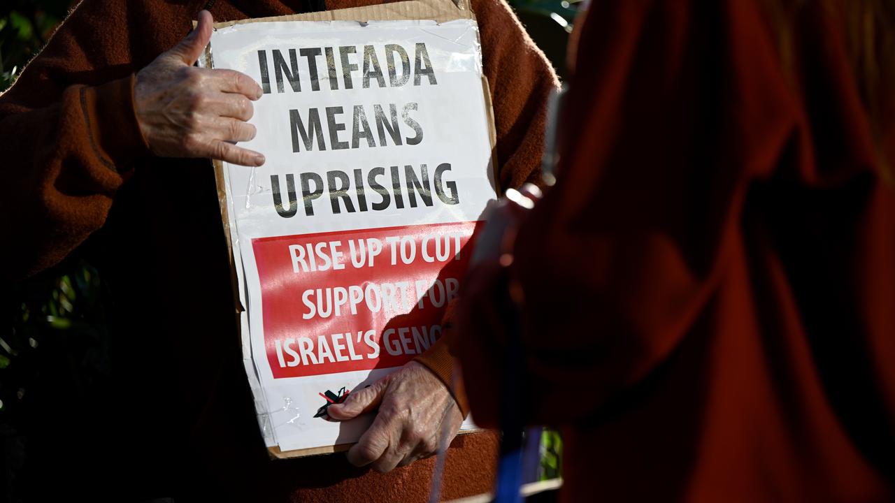 placard reading 'Intifada means uprising'