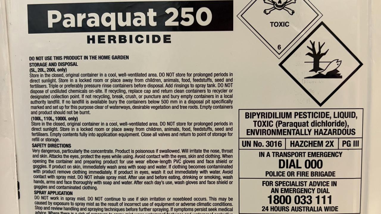 a warning label on a drum of paraquat