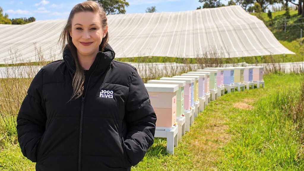 Danielle Munn, founder of 1000 Hives, is proud of the project’s first beehives in an apple orchard.
