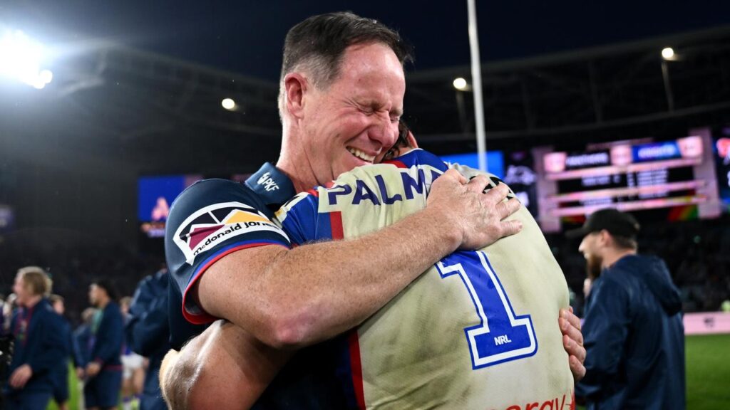 Newcastle coach Justin Holbrook embraces Kalyn Ponga after winning through to the NRL grand final.
