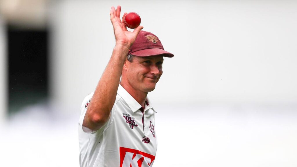 Queensland paceman Cameron Gannon salutes after taking five SA wickets at Adelaide Oval.
