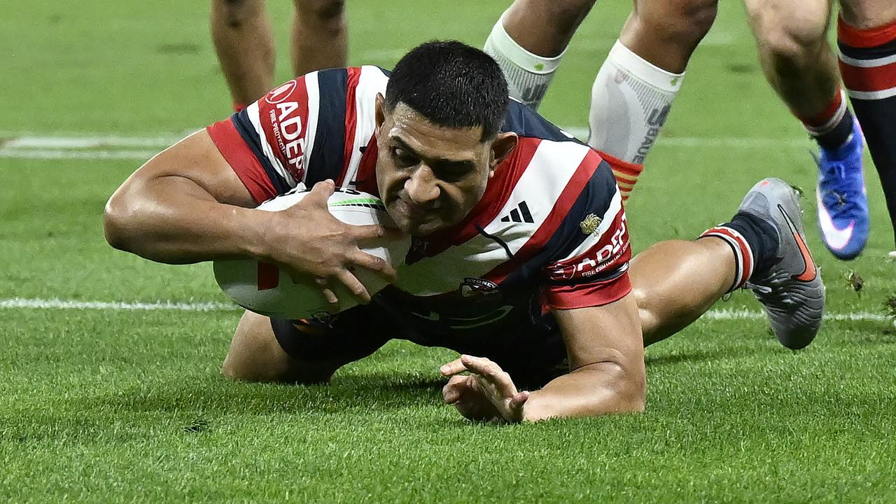 Daniel Tupou of the Roosters scores a try